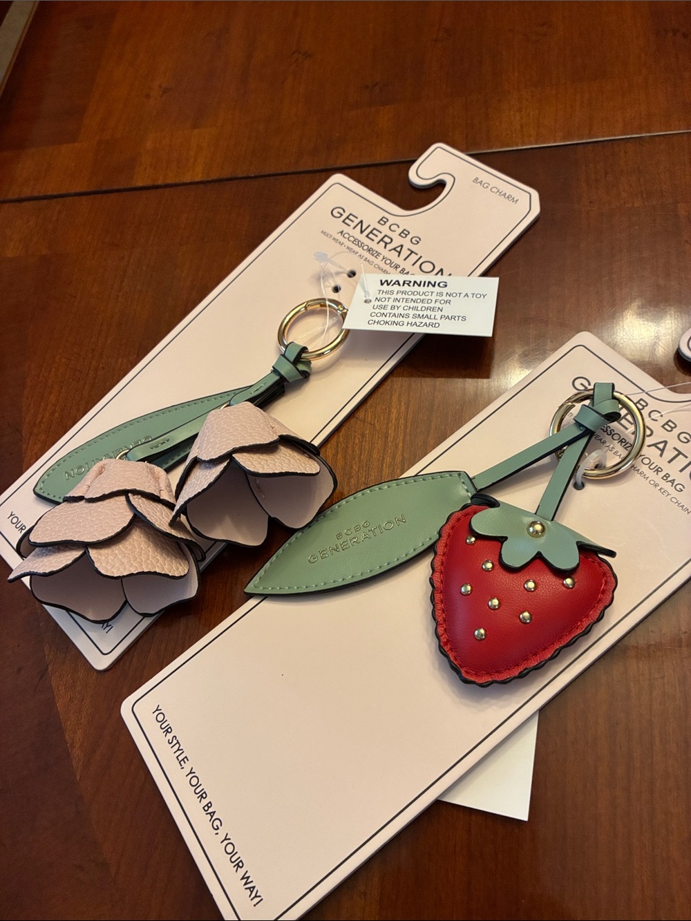 BCBGeneration Pink Floral & Red Strawberry Leather Bag Charms (Set of 2). NWT